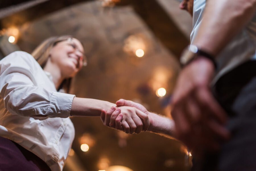 Man and woman shaking hands