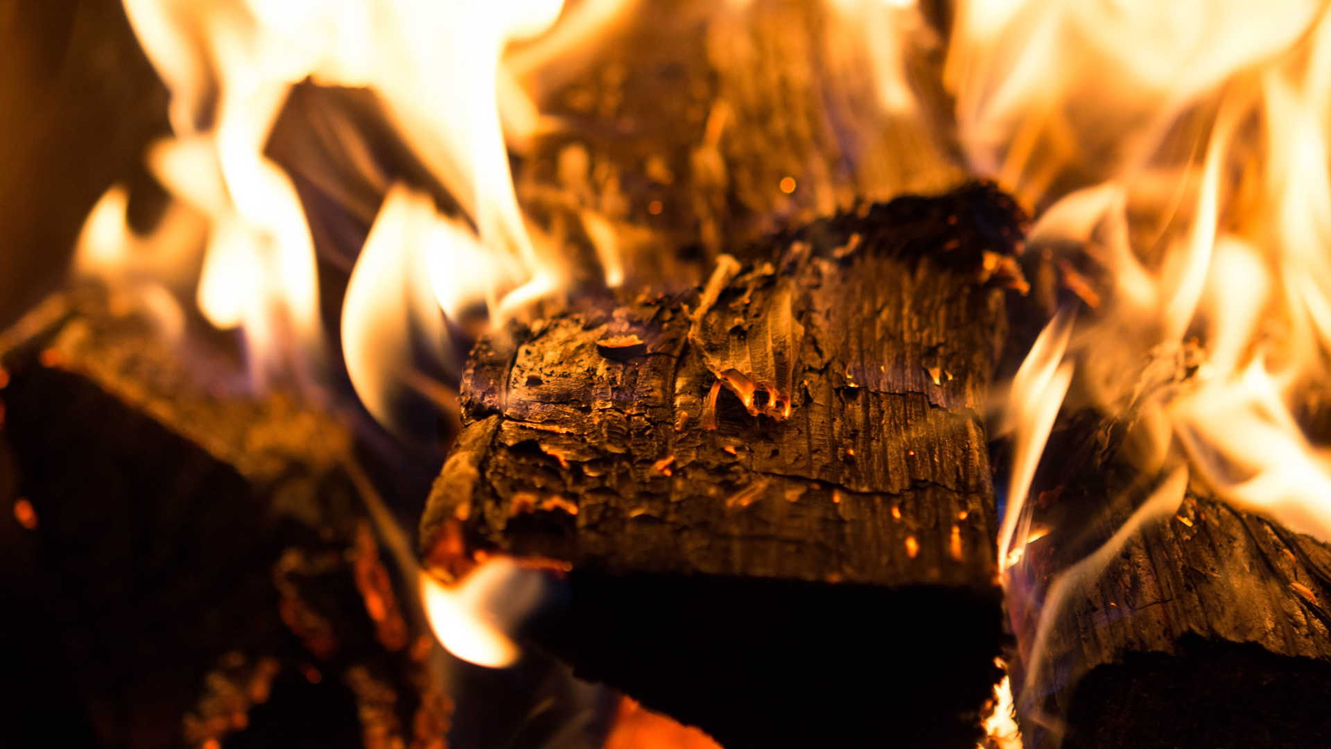 Burning Yule log in a fireplace