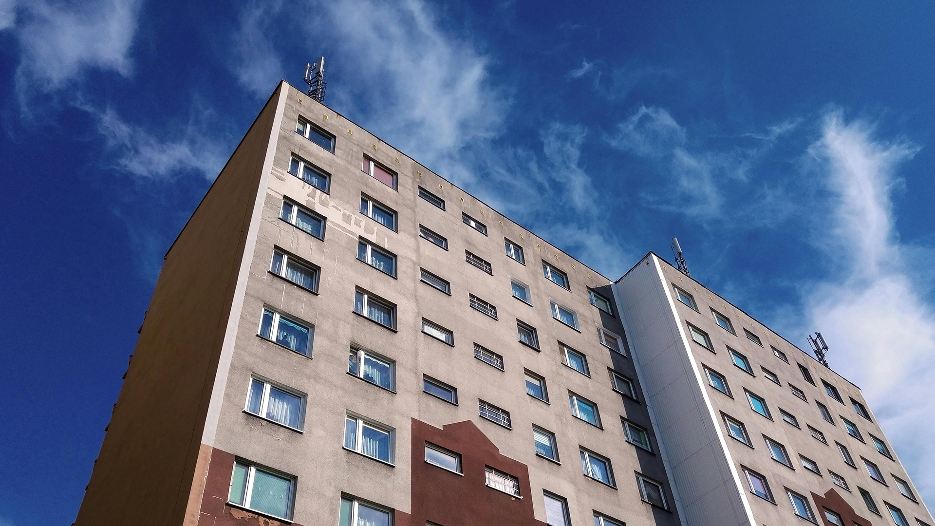 apartment building against a blue sky