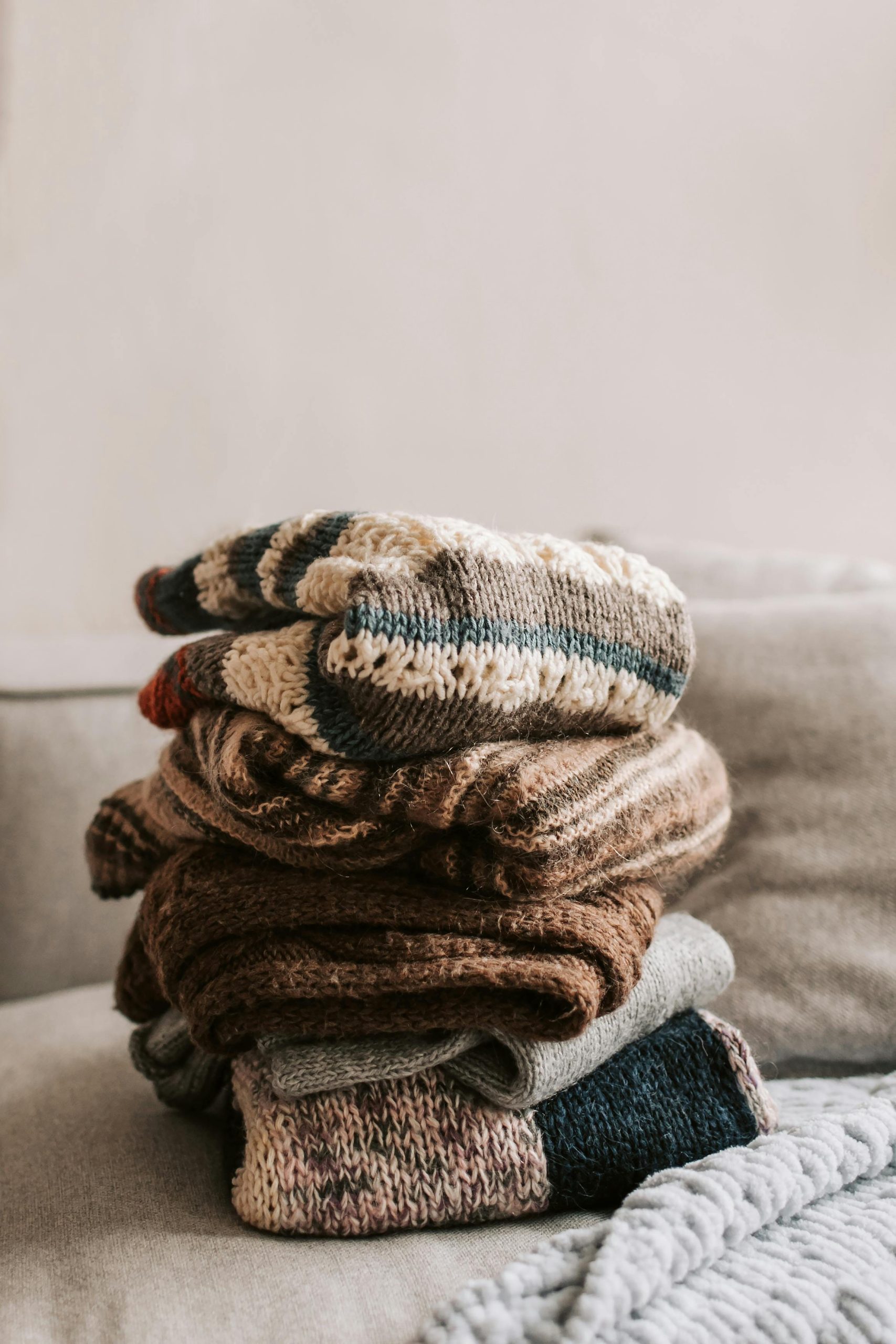 pile of woolen sweaters